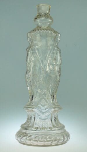 Carafe en verre moulé - Colonne au trois femmes